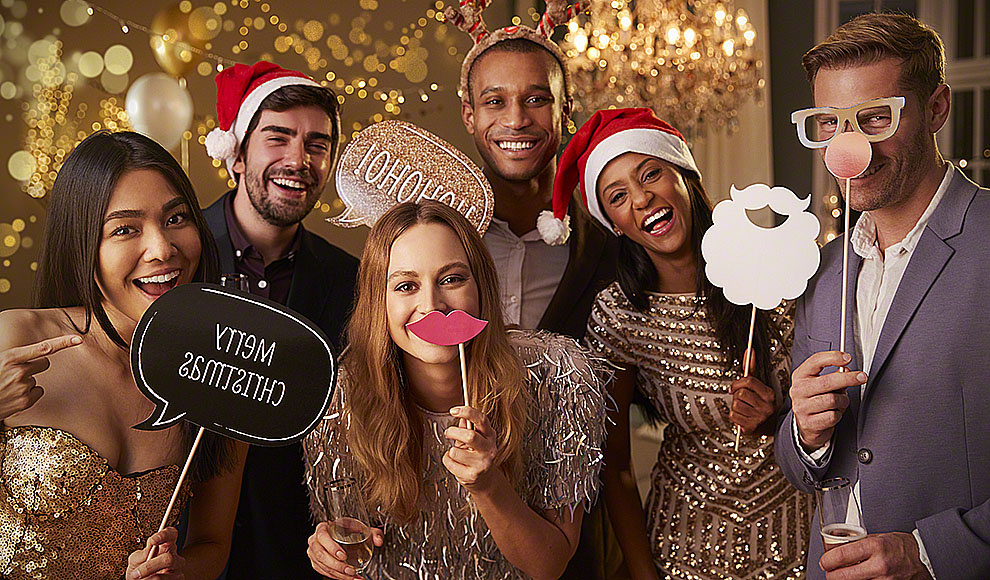 Group Of Friends Dressing Up For Christmas Party Together | Reading ...